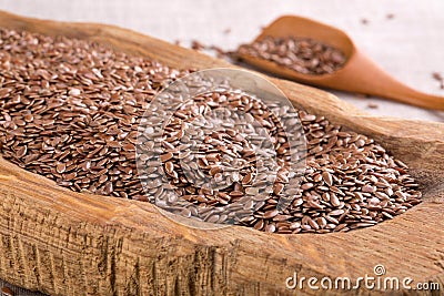 Flax seeds in wooden bowl Stock Photo