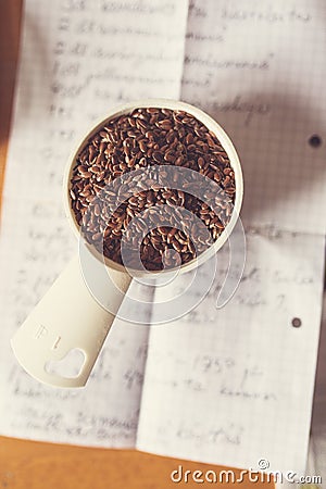 Flaxseeds in a measurement cup Stock Photo