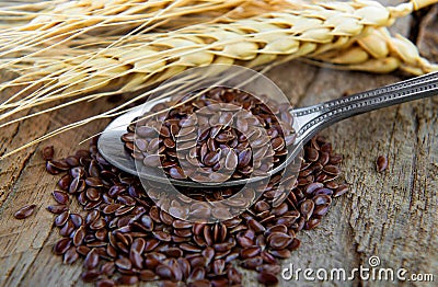 Flaxseeds in spoon Stock Photo