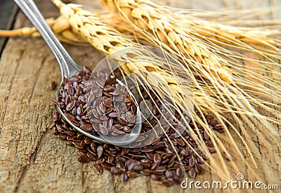 Flaxseeds in spoon Stock Photo