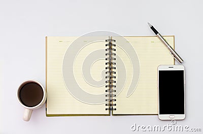 Flay lay space on the desk Area space enter text. mockup coffee cups, Pen note paper Placed on a White table wood Stock Photo