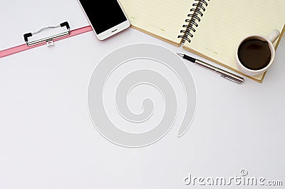 Flay lay space on the desk Area space enter text. mockup coffee cups snack candy, Pen note paper Placed on a White table top vie Stock Photo