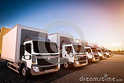 Fleet of commercial delivery trucks on cargo parking Stock Photo