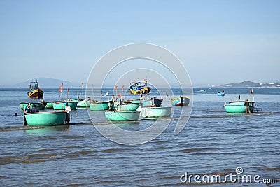 Fleet round plastic boats after fishing in the Fishing harbour of Mui Ne. Vietnam Editorial Stock Photo