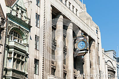 Fleet Street building with retro clock. Stock Photo