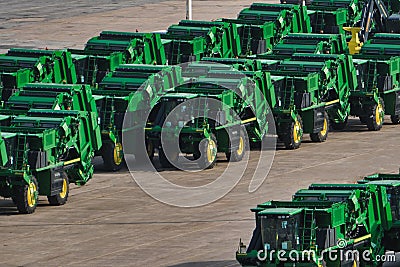 Fleet of tractors lined up in a shipping yard Editorial Stock Photo