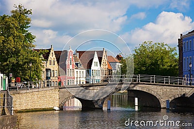 Flemish houses and bridge over canal in Brugge Stock Photo