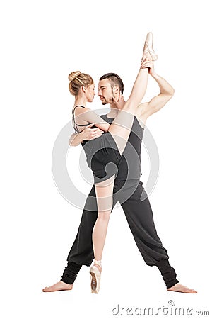 Flexible ballet dancer in split with her partner Stock Photo