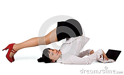 Flexible businesswoman with laptop Stock Photo