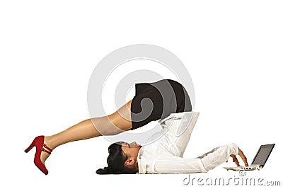 Flexible businesswoman with laptop Stock Photo
