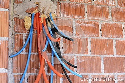 Flexible Electrical Conduit Corrugated Plastic Tubes on the wall Stock Photo