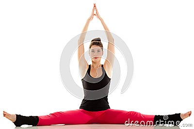 Flexible girl doing stretching pilates exercise Stock Photo