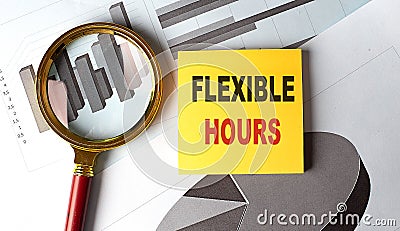 FLEXIBLE HOURS text on sticky on chart, business Stock Photo