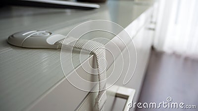 Flexible latch on the cabinet. Stock Photo