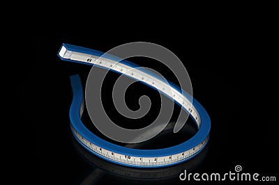 Flexible ruler on a black background Stock Photo