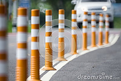 Flexible traffic bollard for bike lane. Stock Photo