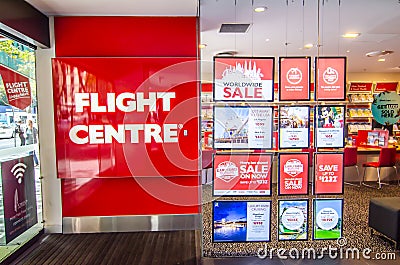 Flight Centre is the largest retailer of travel in Australia, image shows the shopfront with sale promotion detail on glass window Editorial Stock Photo