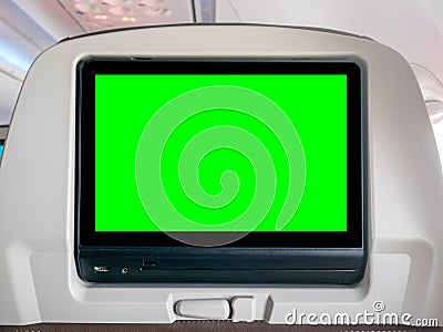 In-Flight Entertainment with Green Screen, Seatback Screen with Green Screen in Airplane Stock Photo