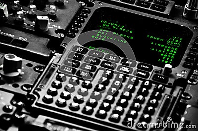 Flight navigation computer and buttons and switches in the flightdeck of an airplane Stock Photo