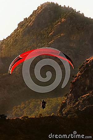 The flight of paragliders in the highlands. Paragliding at dawn. Taking photos from a heigh Editorial Stock Photo