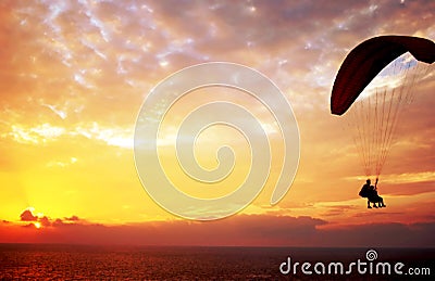 Flight of paraplane above Mediterranean sea Stock Photo