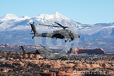 A flight of three Apache helicopters fly over Southern Utah Editorial Stock Photo