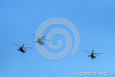 The flight of three soviet battle helicopters Stock Photo