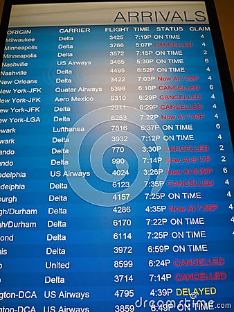 Flights Cancelled -- Arrivals board with flight ca Editorial Stock Photo