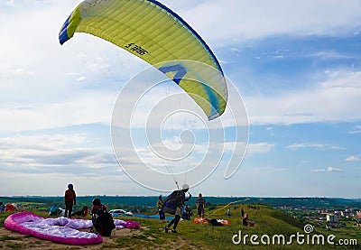 Flights from the mountain by paragliders Editorial Stock Photo