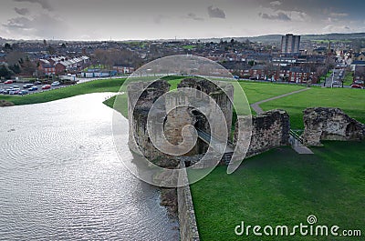 Flint Castle seen on the day of an unusually high spring tide Stock Photo