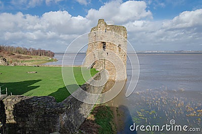 Flint Castle seen on the day of an unusually high spring tide Stock Photo