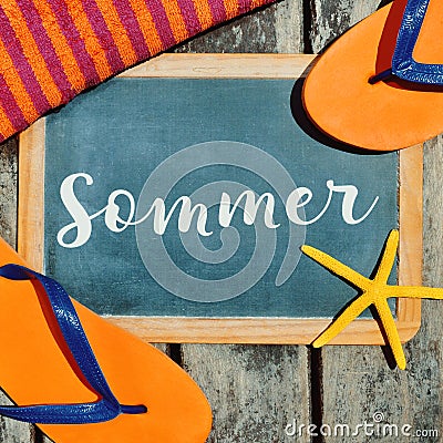 Flip-flops, starfish and text sommer, summer in German Stock Photo