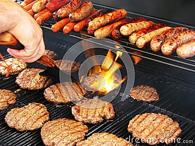 Flipping Hamburgers Stock Photo