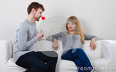 Loving pare with heart flirting. Stock Photo