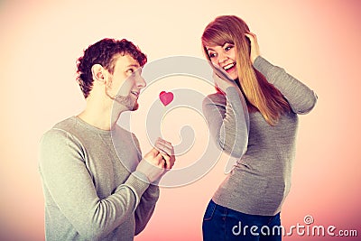 Loving pare with heart flirting Stock Photo