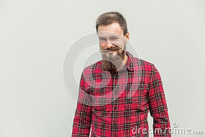 Flirt and wink. Carefree bearded man winked at camera and smiling Stock Photo
