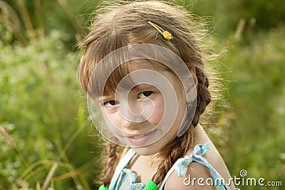 Flirtatious dark-haired girl with pigtails Stock Photo