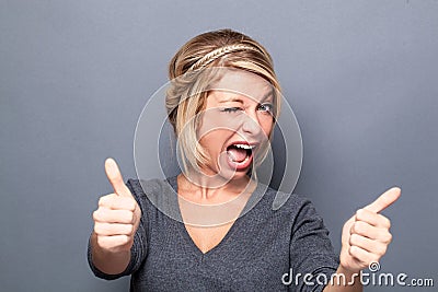 Flirting young woman winking and smiling for cool attitude Stock Photo
