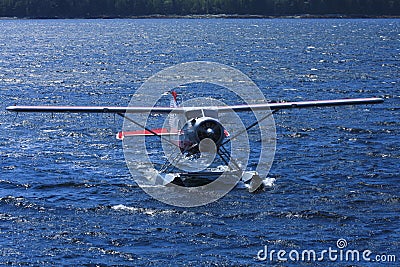 Float plane in blue ocean water Stock Photo