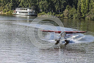 Float plane landing on Chena Rive Stock Photo