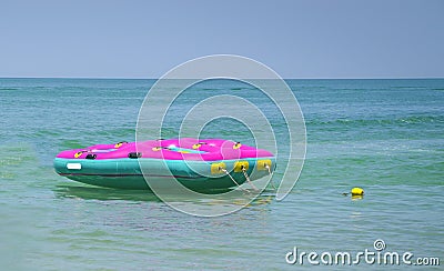 Floater in the middle of the emerald blue sea Stock Photo