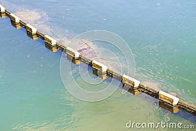 Floating anti-pollution barrier made with modular plastic elements Stock Photo