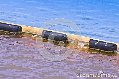 Floating anti-pollution barrier made with modular plastic elements - image with copy space Stock Photo