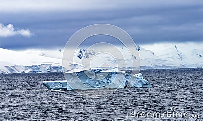 Floating Blue Iceberg Snow Mountains Glaciers Antarctica Stock Photo