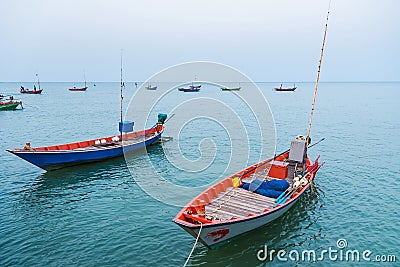 Floating fishing boats aground at the harbor over cloudy sky at Chanthaburi, Thailand Stock Photo