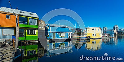 Floating Home Village Houseboats Fisherman`s Wharf Inner Harbor, Victoria British Columbia Canada.Area has floating homes, boats, Stock Photo