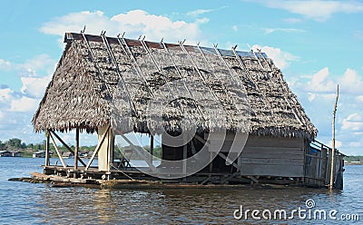 Floating house on Amazon river Stock Photo