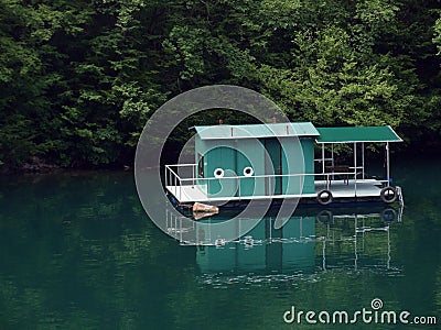 Floating house on lake. Stock Photo