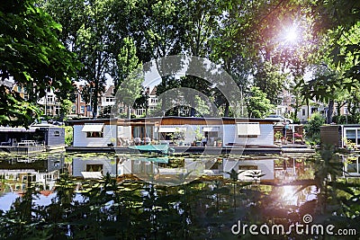 Floating houses surrounded by vegetation Stock Photo