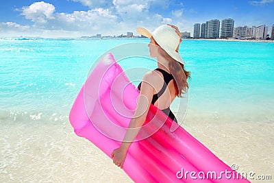 Floating lounge pink girl in caribbean beach Stock Photo